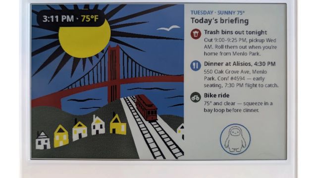 A white E Ink display shows a bridge illustration beside a daily briefing and reminders
