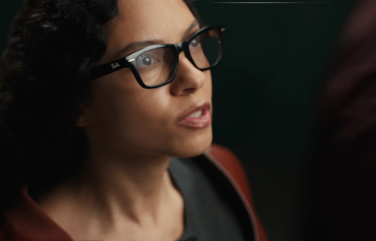 Person wearing black Ray-Ban Meta Audio glasses while speaking to Meta's assistant
