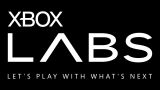 White Xbox Labs lettering on black with the words Let's play with what's next